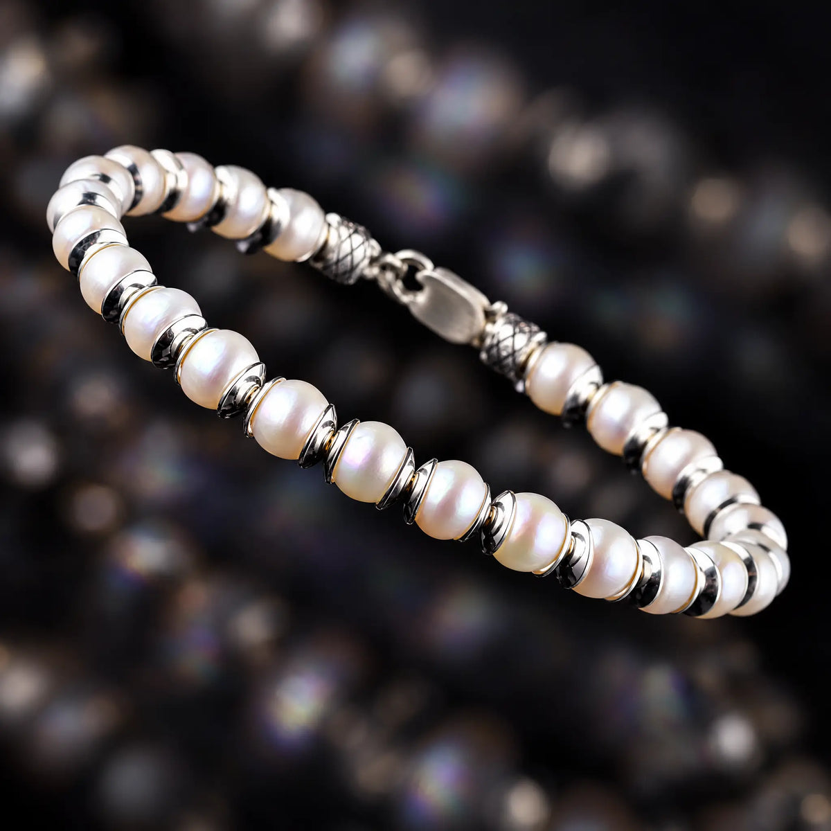 White Pearl Bracelet II (6.5mm) by Aurum Brothers, angled view of the white pearls, silver spacers and clasp.