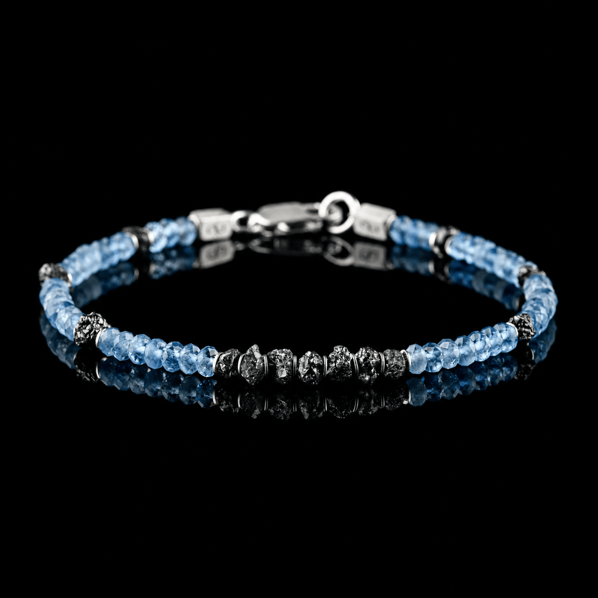 Front view of Raw Black Diamond - Aquamarine Bracelet I (4mm), showing the complete bracelet on a black reflective surface.