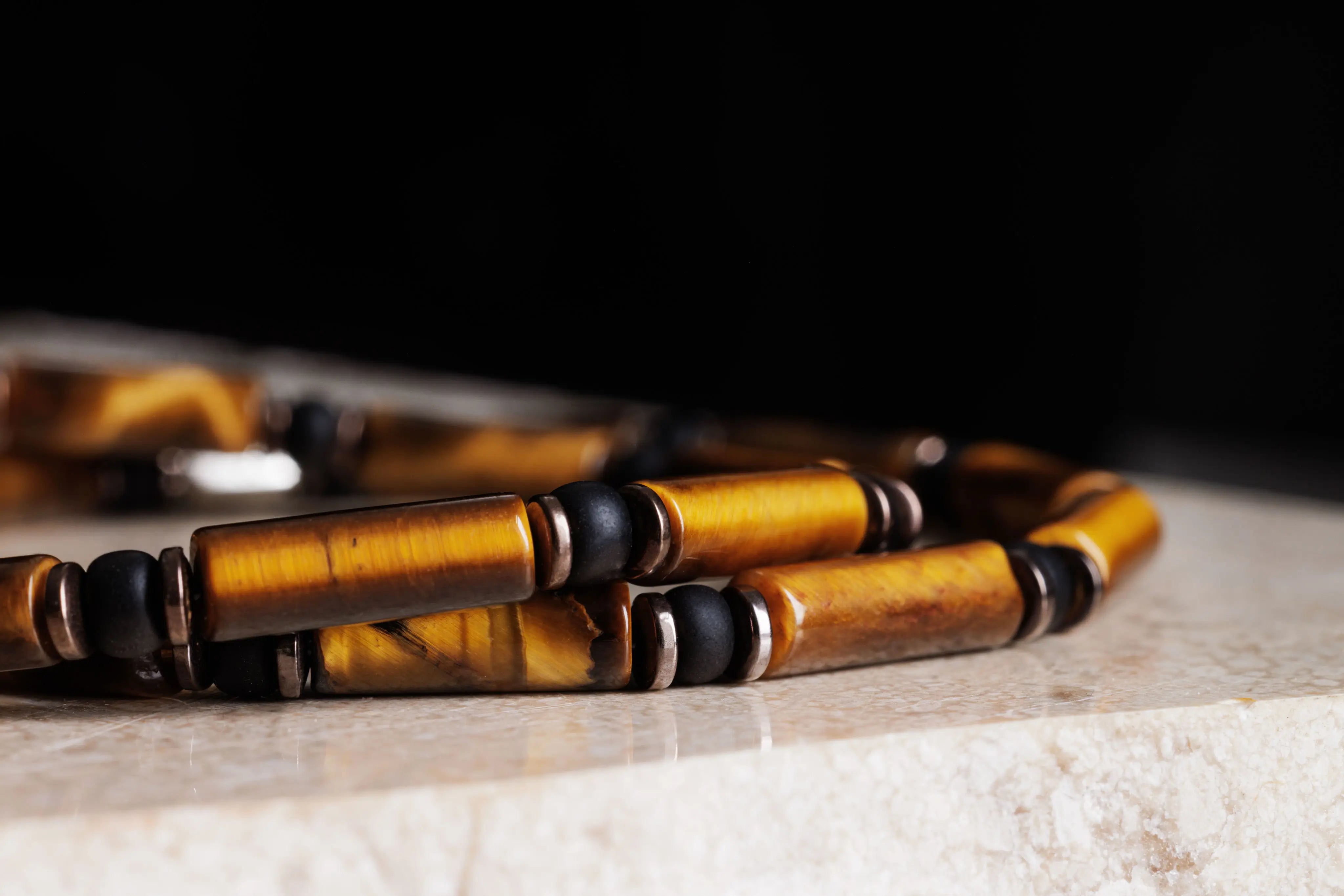 Tiger eye bracelet for men, side view on natural stone. 4mm Parvus tube design. Aurum Brothers.